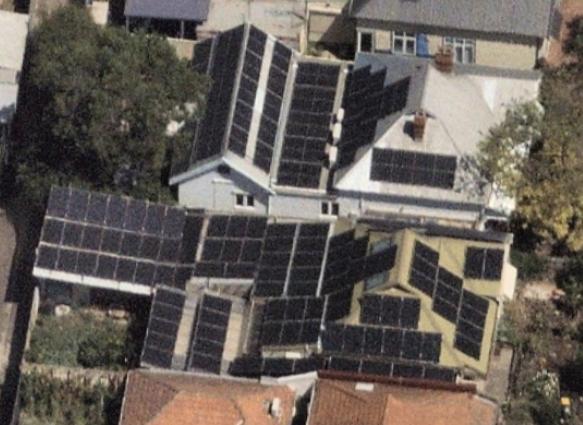 Rooftop solar panels on residential homes in Australia, highlighting the widespread adoption of renewable energy solutions.